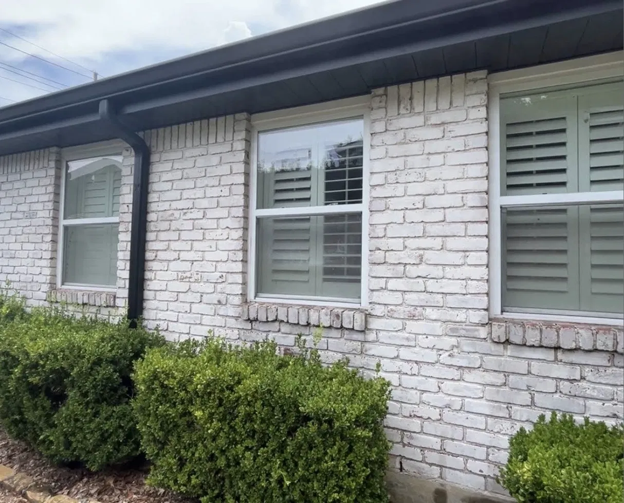 White brick ranch · freshly cleaned panes