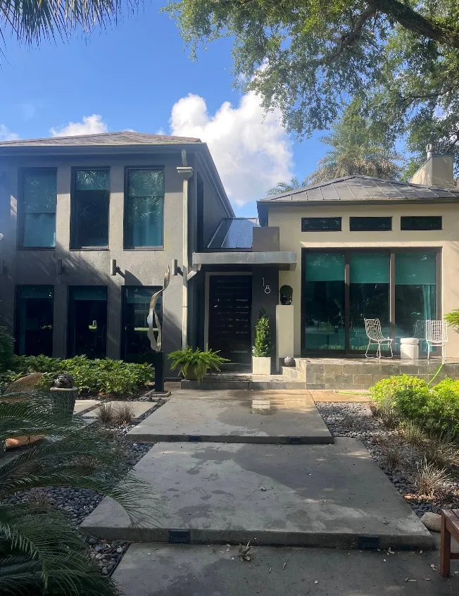 Modern stucco · floor-to-ceiling glass