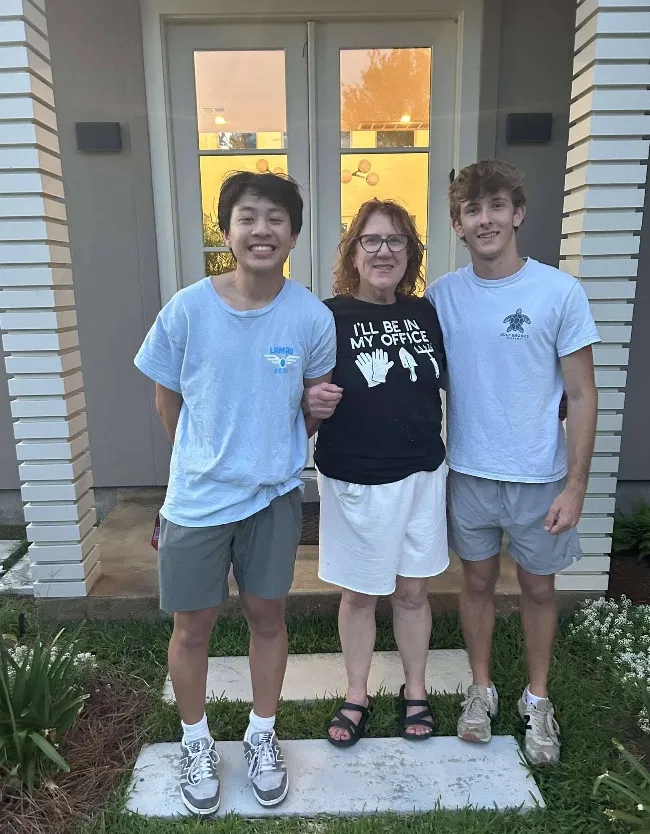 The Shute-Nguyen team with a neighbor